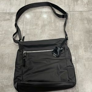 Tumi dark gray handbag.